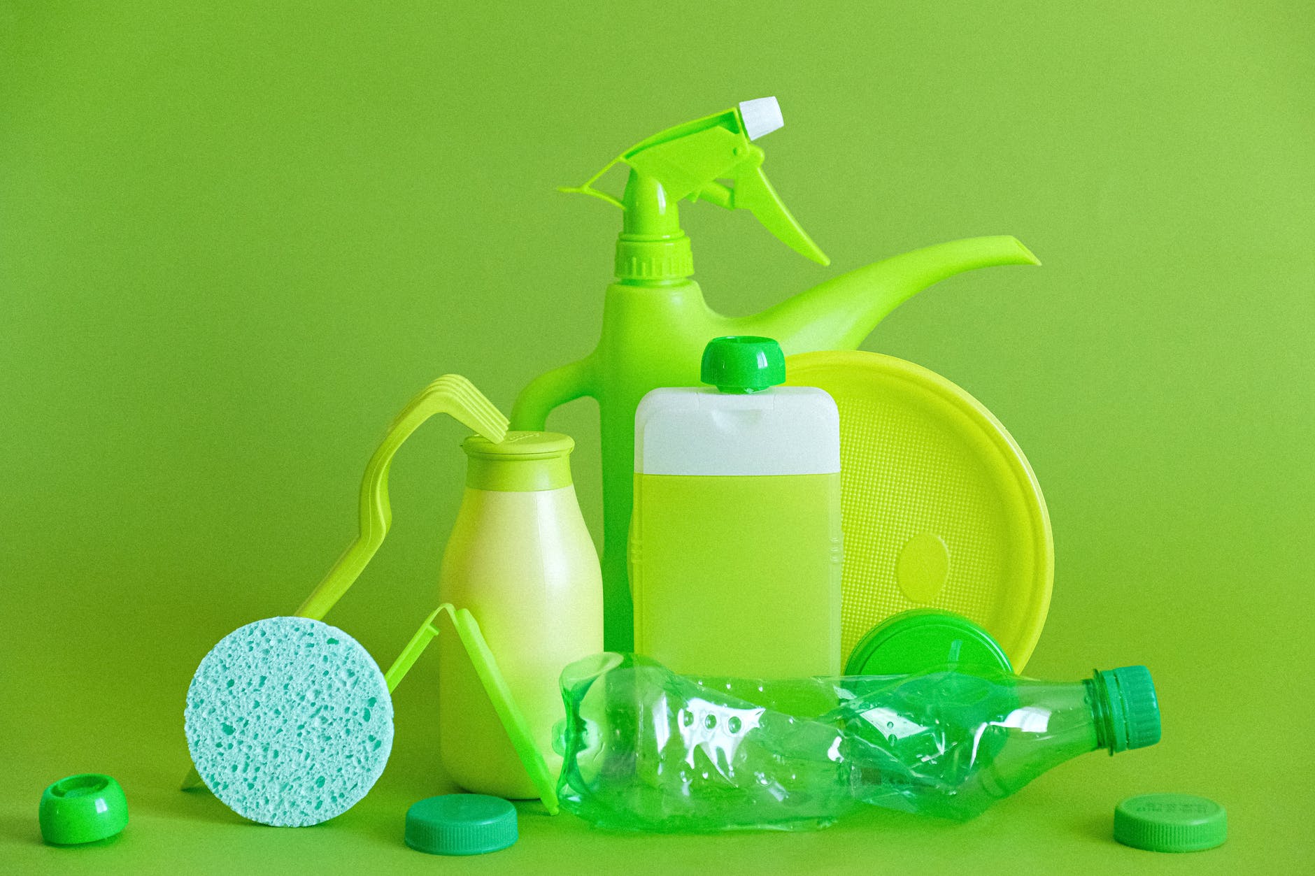 reusable containers and crumpled bottle with kitchen utensils