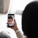 crop couple having video call with black girl