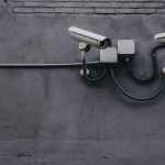 two gray bullet security cameras