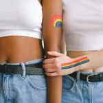women with gay pride body paint