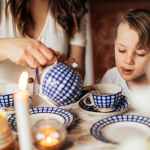 photo of person s hand pouring liquid to cup