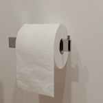 white toilet paper roll on toilet paper holder