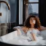 woman in bathtub with water