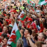 Red wall fans in the street with the Welsh flag prominent