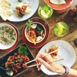 person eating using chopsticks