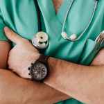 crop unrecognizable male doctor with stethoscope