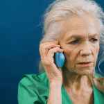 elderly woman talking on the phone