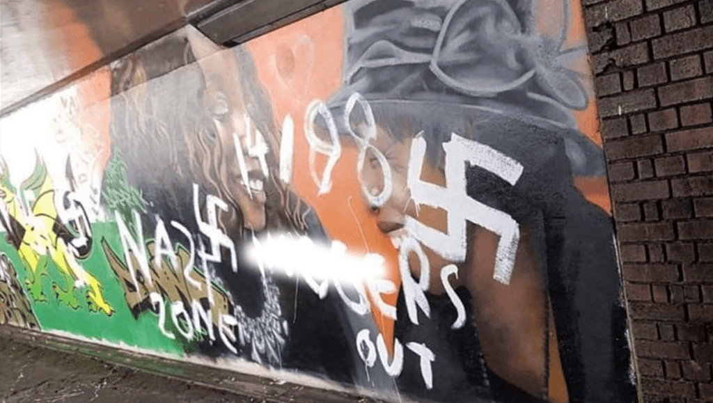 The Windrush mural in Port Talbot that was defaced with racist slogans