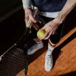 a person holding a tennis racket