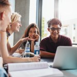 Students sat around a desk