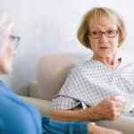 aged women talking while drinking tea