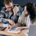 couple calculating all their bills