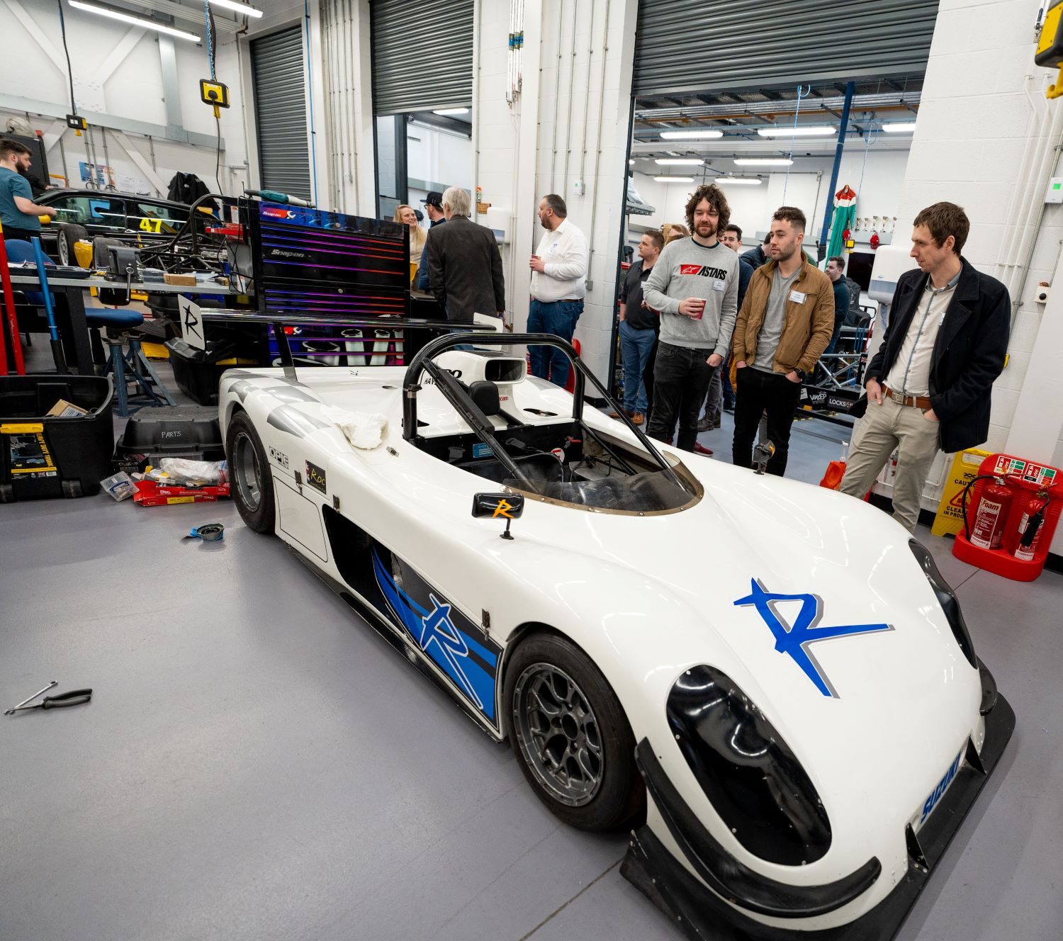 Admiring race cars at UWTSD's Motorsports Engineering workshop