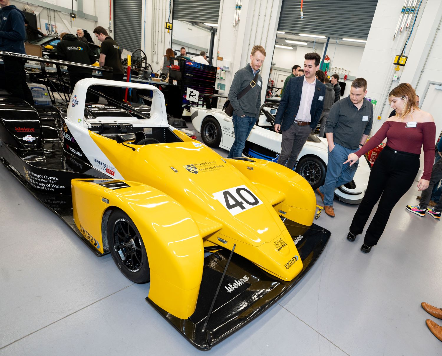 Admiring race cars in UWTSD's motorsports engineering workshop
