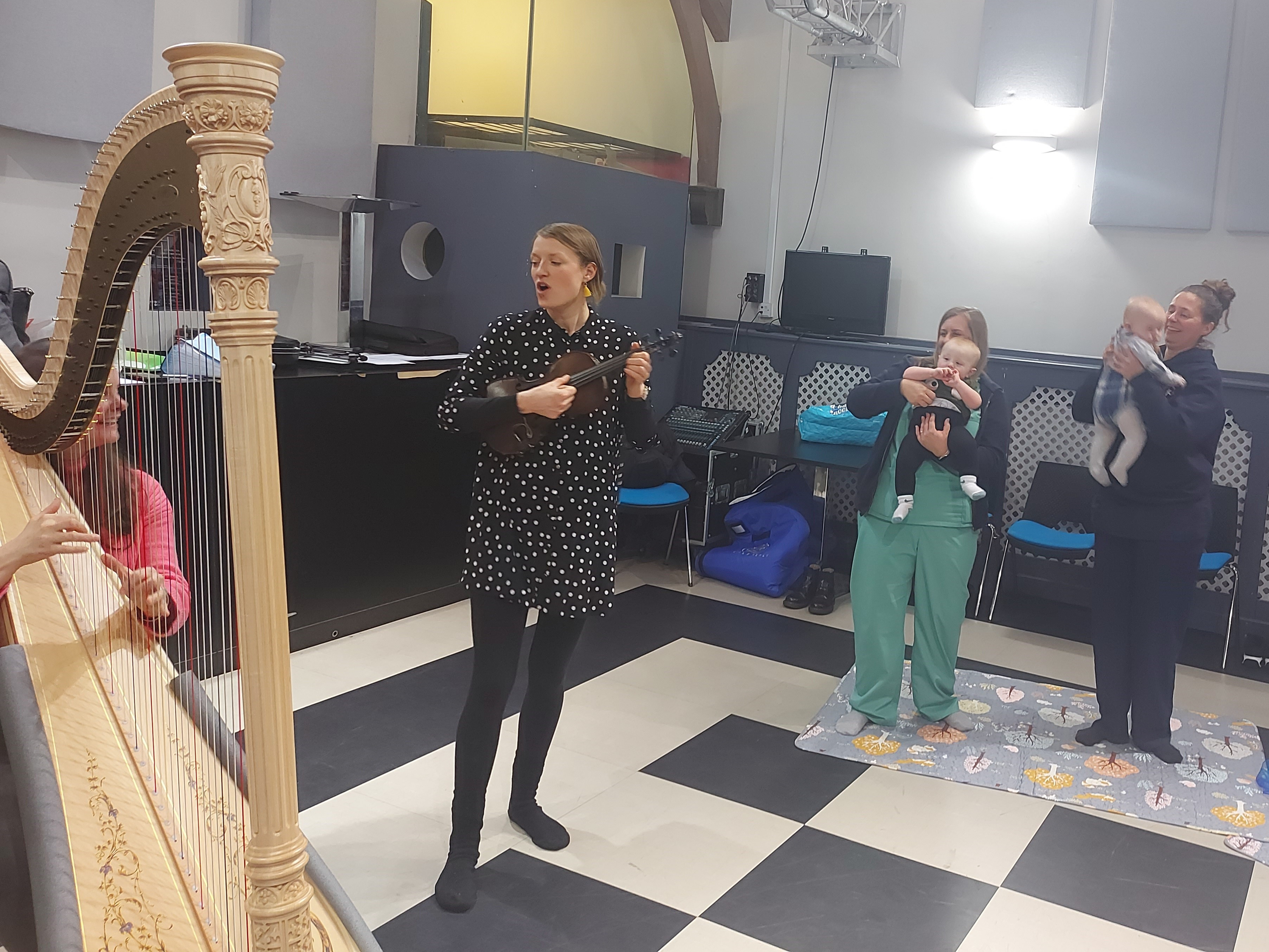 Parents and babies of the Lullaby Project in Swansea interact and play with instruments together