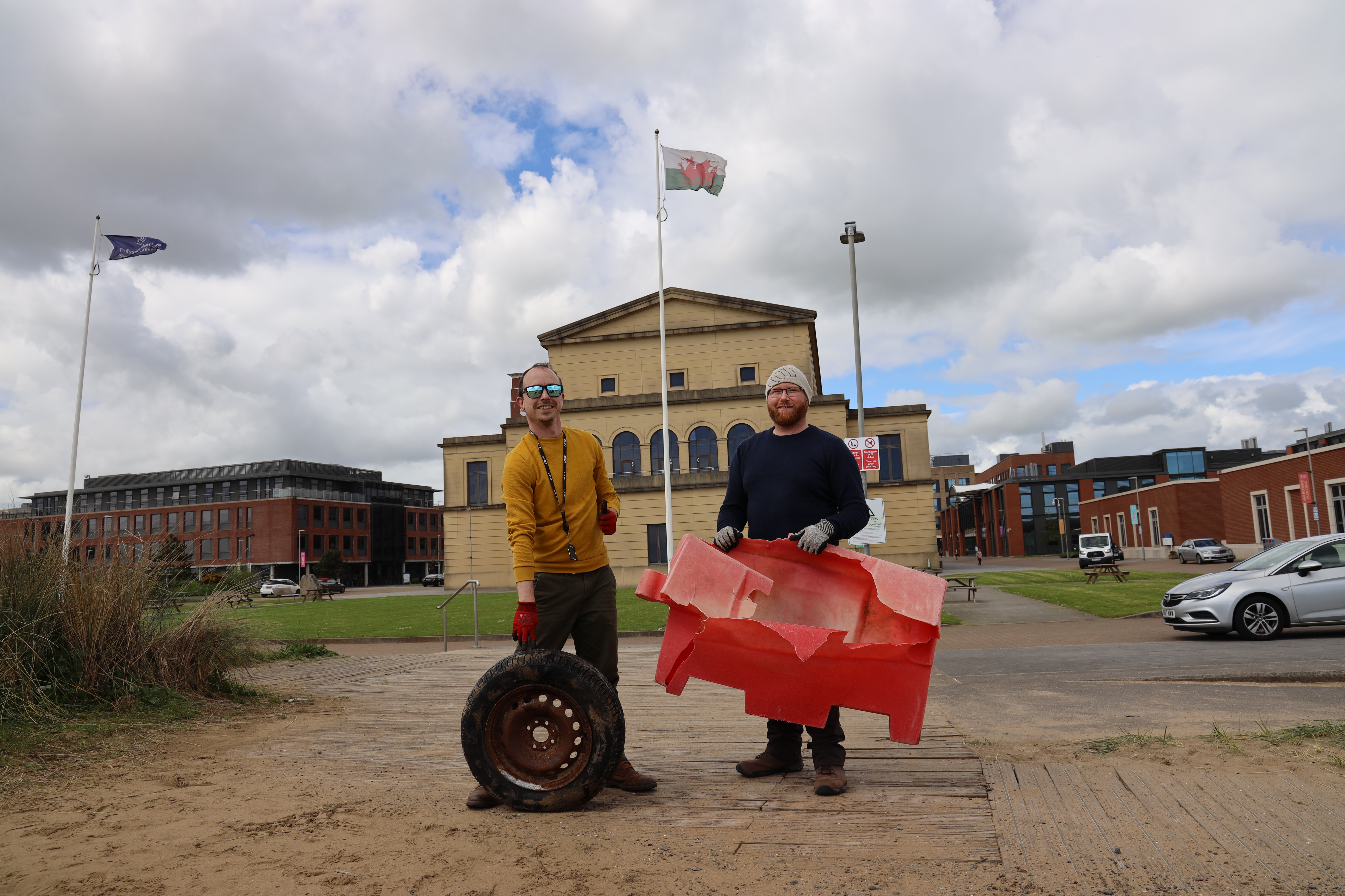 Staff with some of the rubbish they collected from the beach at Swansea University’s Bay Campus