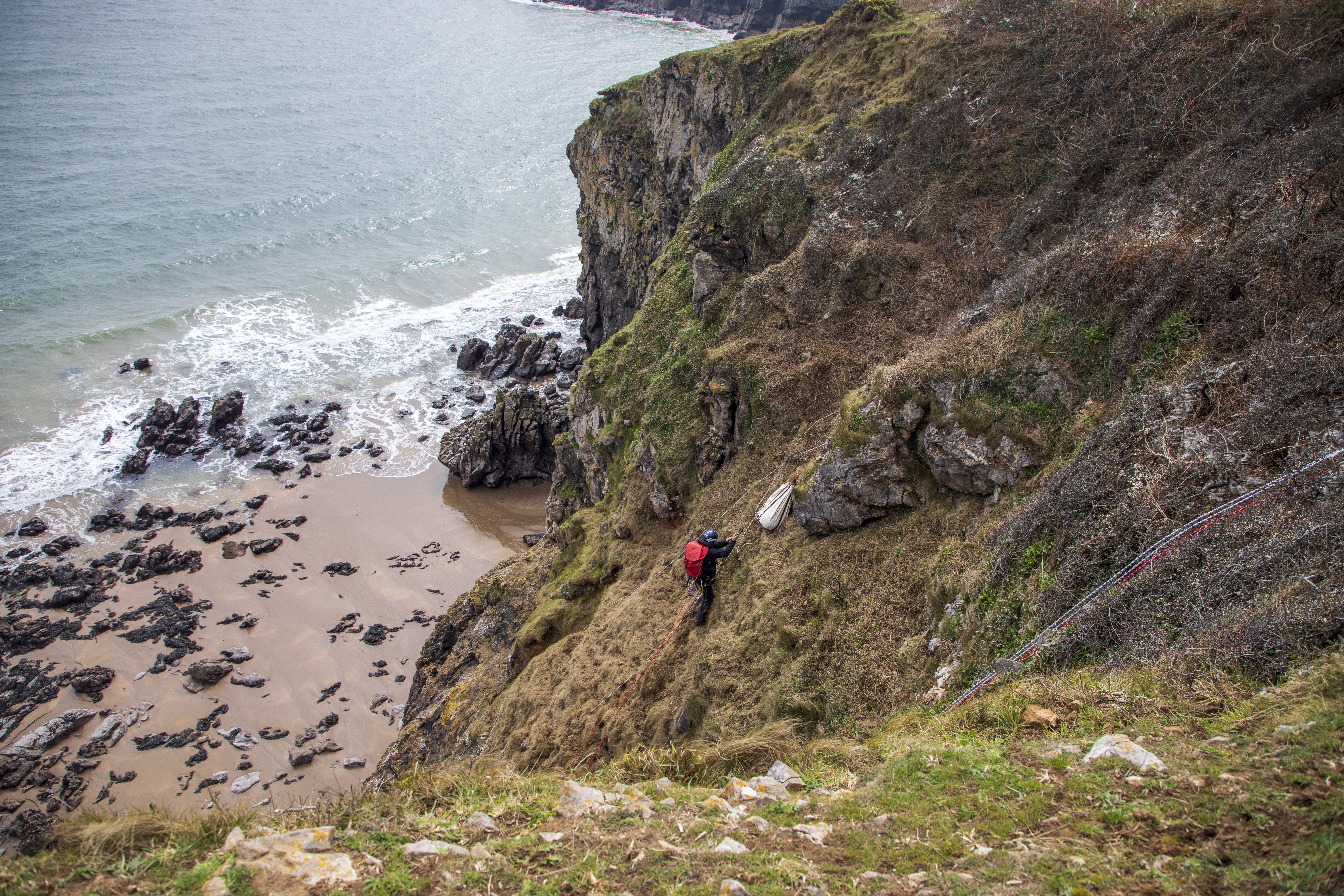 The dramatic cliff face rescue under way