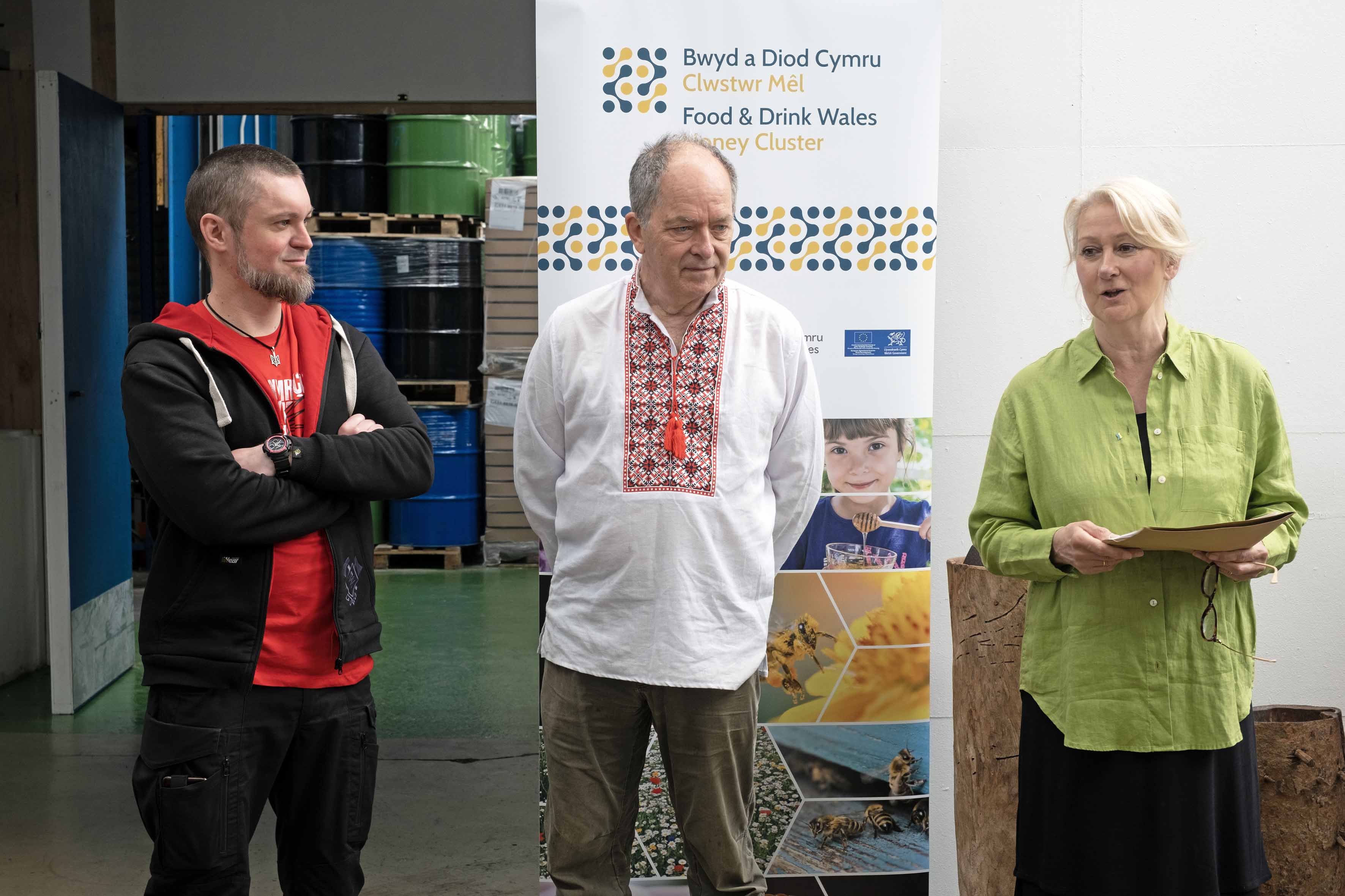 Honey Brothers co-founder, Dmytro Kushnir (left) with Wainwright’s Bee Farm director, David Wainwright and Welsh Honey Cluster Lead Haf Wyn Hughes.