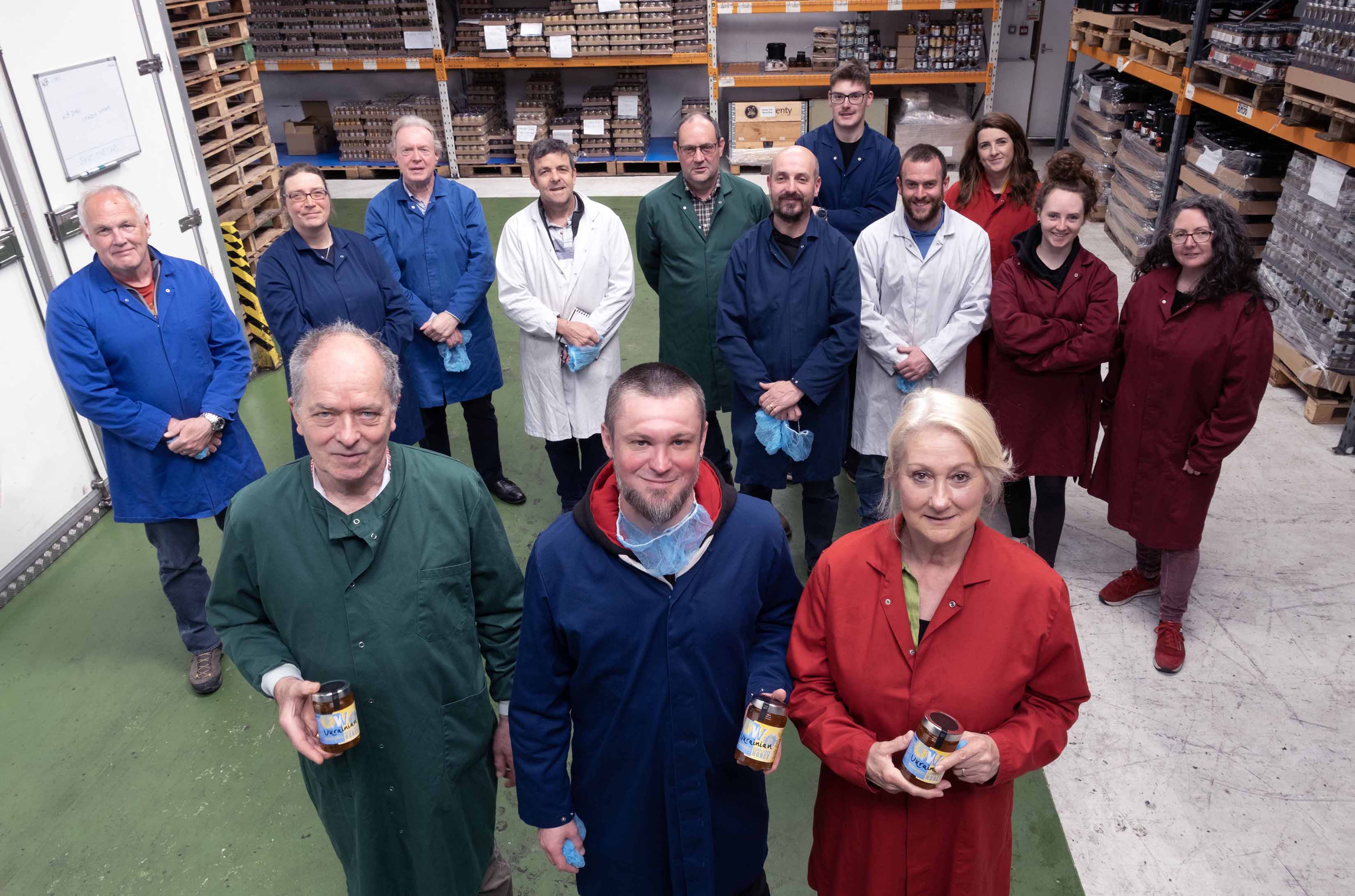 Members of the Welsh Honey Cluster with Wainwright’s Bee Farm director, David Wainwright (front left), Honey Brothers co-founder, Dmytro Kushnir (front centre) and Welsh Honey Cluster Lead Haf Wyn Hughes (front right).