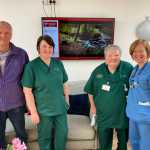 Lead image: Volunteer Chinch Gryniewicz with Ty Olwen staff Melissa Phillips, Diane Isaac and Angharad Griffiths. (Image: Swansea Bay NHS)