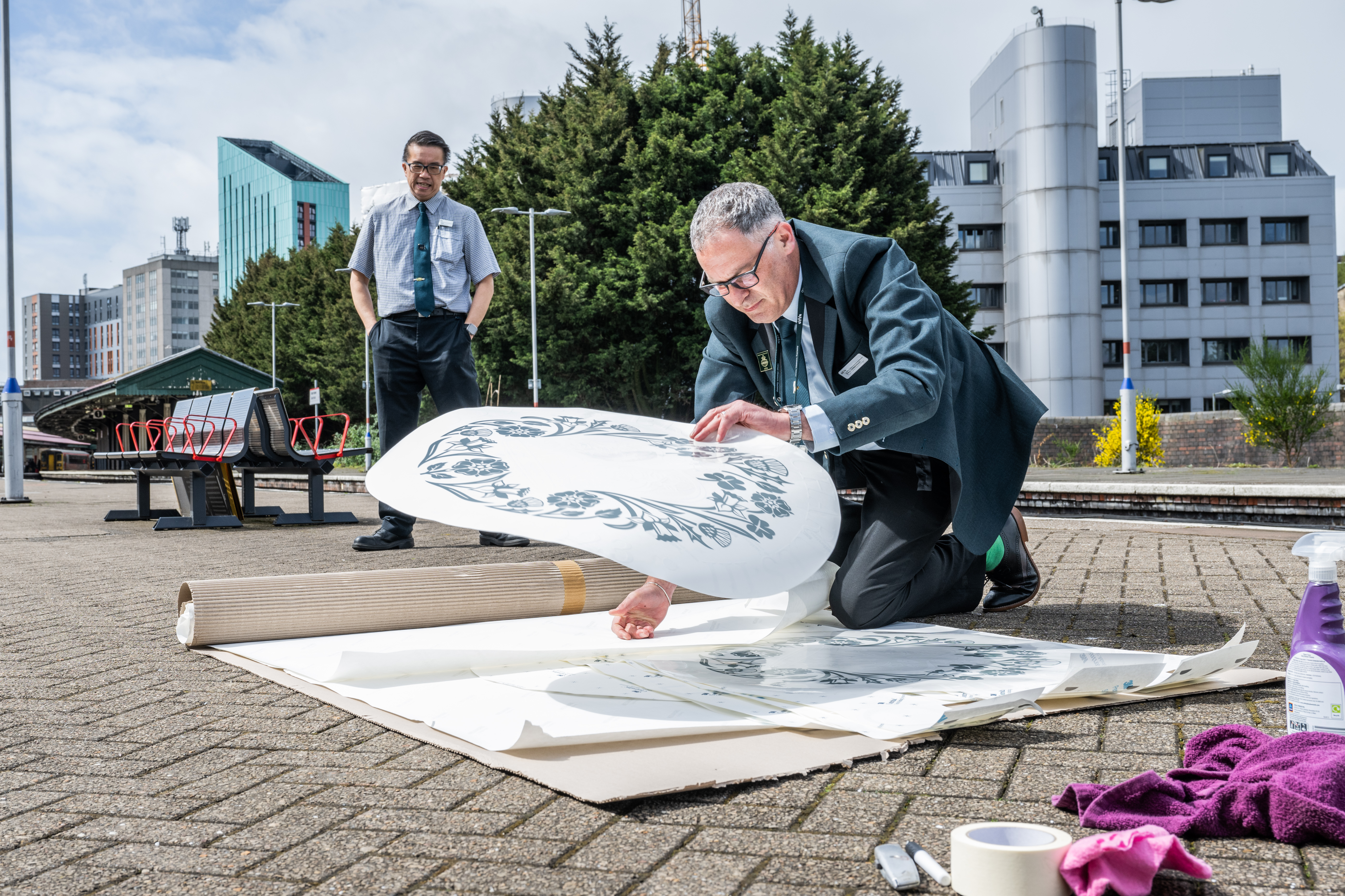Project Communications Manager for GWR Paul Gentleman applies the vinyls at Swansea.