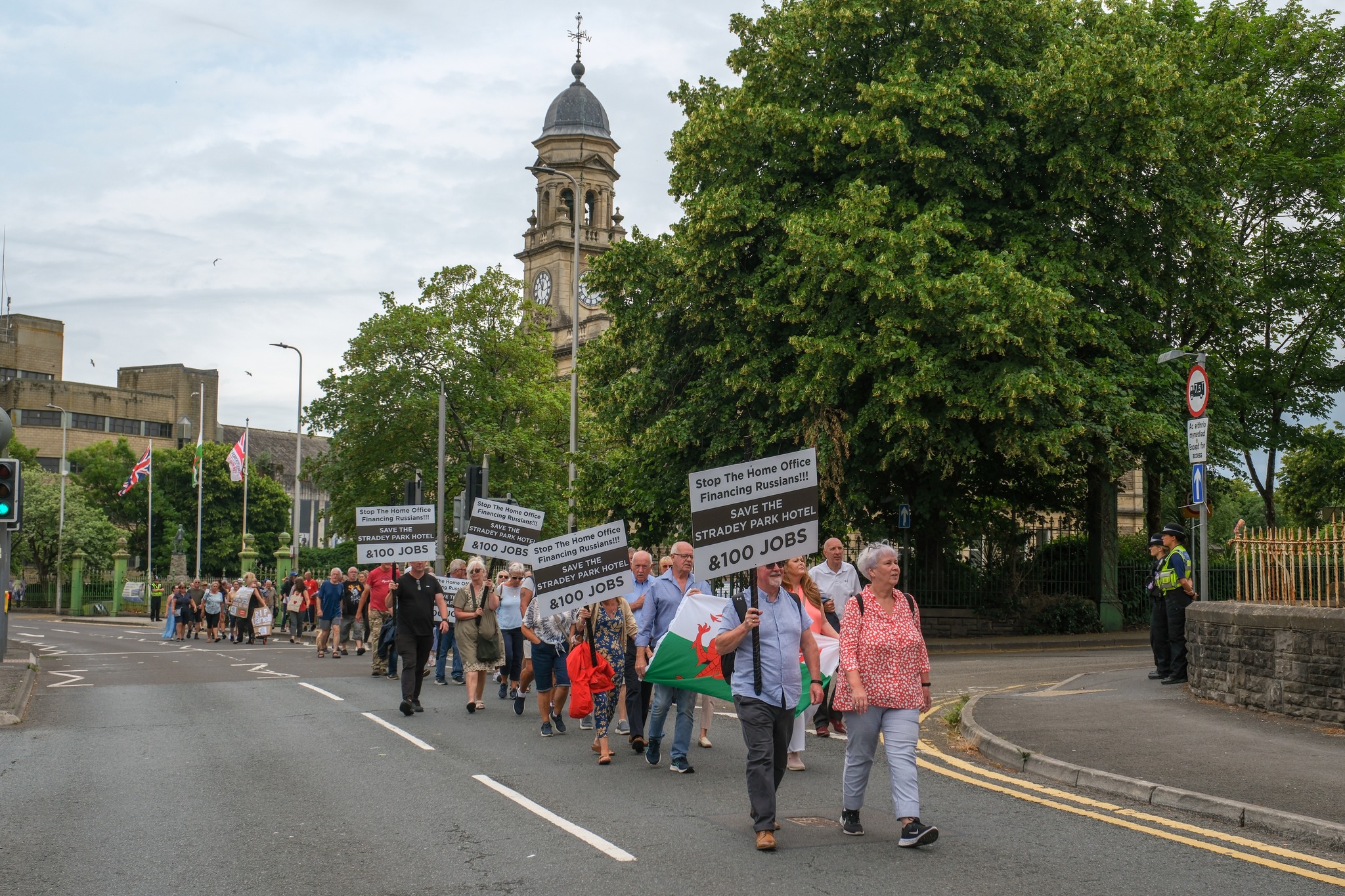 Protesters take to the streets agains the plans to house asylum seekers at Llanelli's Stradey Park Hotel. (Image: Graham Harries)