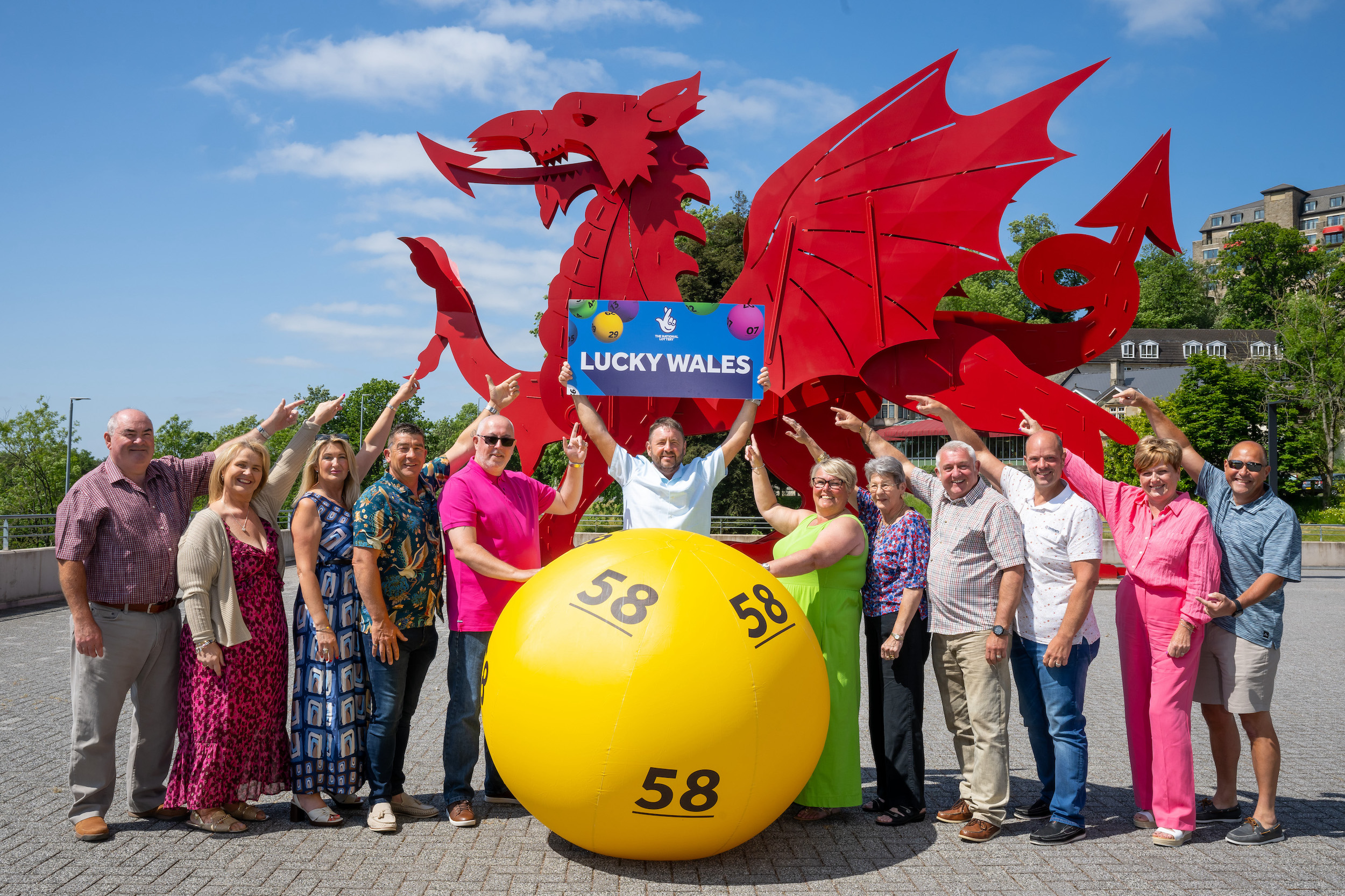 Welsh National Lottery millionaires celebrate Wales’ officially lucky status (L-R Jeffrey & Davinia Pritchard (£1M), Geraldine & Chris Bradley (£3.5M), Mark Francis (£1M) Nigel Willets (£1M) Helen Taylor Yvonne Bradley, Ian Pearce & Lyn Sexton (£1M) Julie & Chris Amphlett (£4.2M).