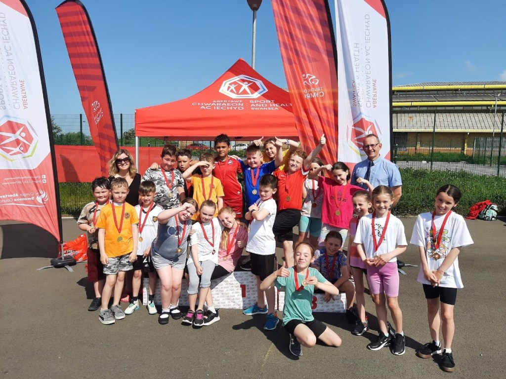 Schoolchildren from Ysgol Gynradd Gymraeg Gellionnen in Clydach, Swansea, enjoying the GO TRI event.