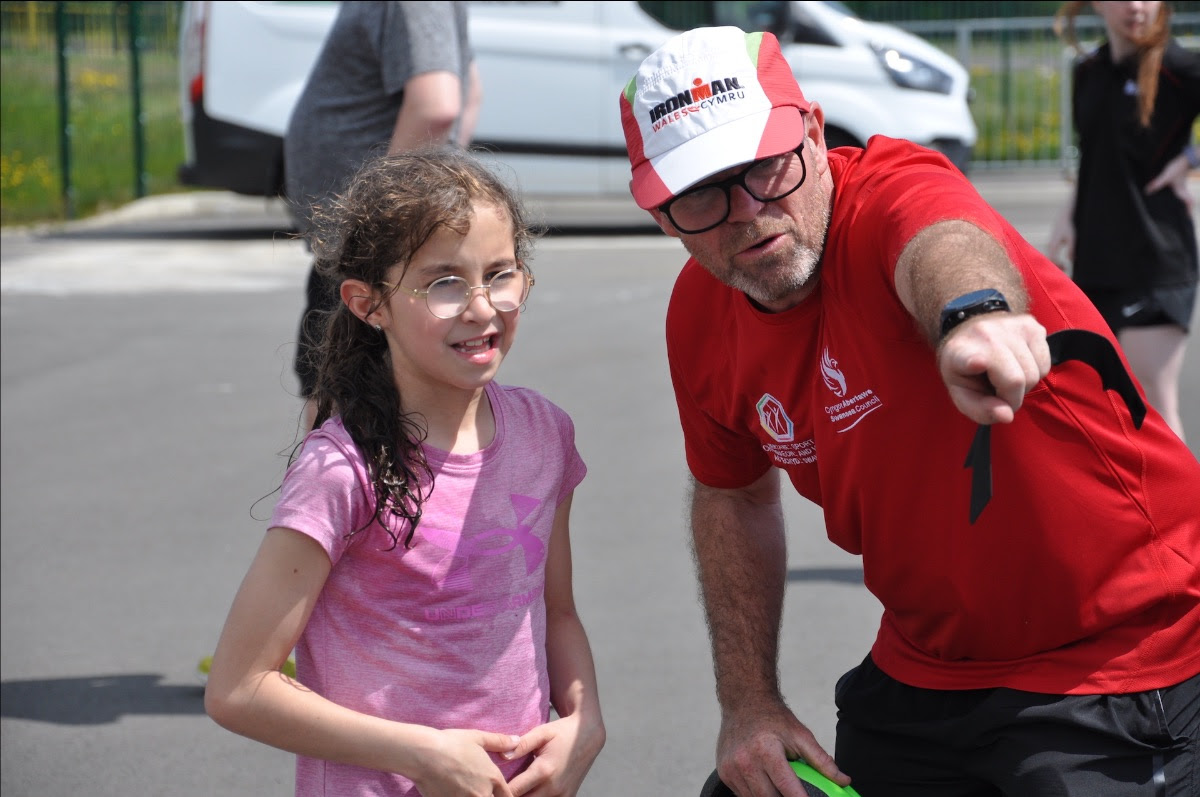 Sienna Allen-Chaplin gets directions from Mark Evans (Sport and Health Swansea).