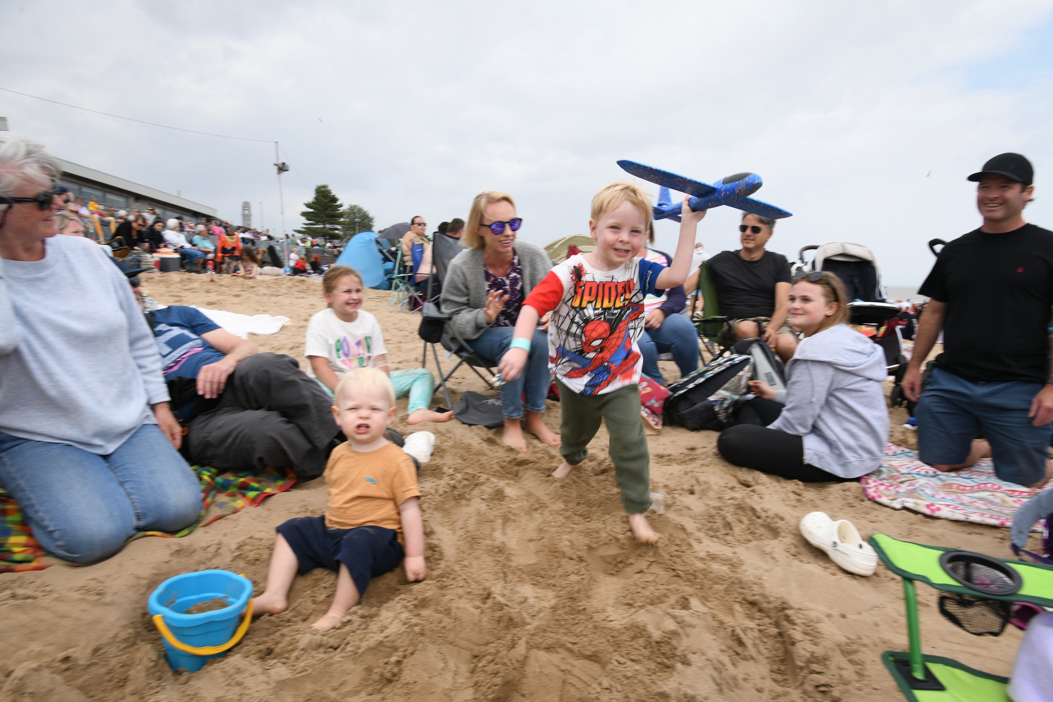 Jack Lloyd from Newton aged 3 flying amongst the crowds on Swansea Bay Beach.