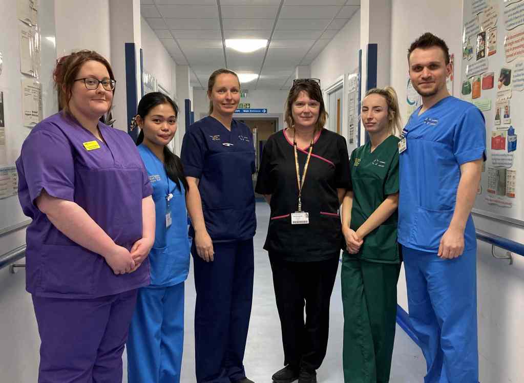 Molly Lloyd, student nurse; staff nurse Anna Sagnip; Ceri James, Ward B Manager; Cath Beynon, Ward B receptionist; Jessica Roberts, Health Care Support Worker and staff nurse Marius Lazau.
