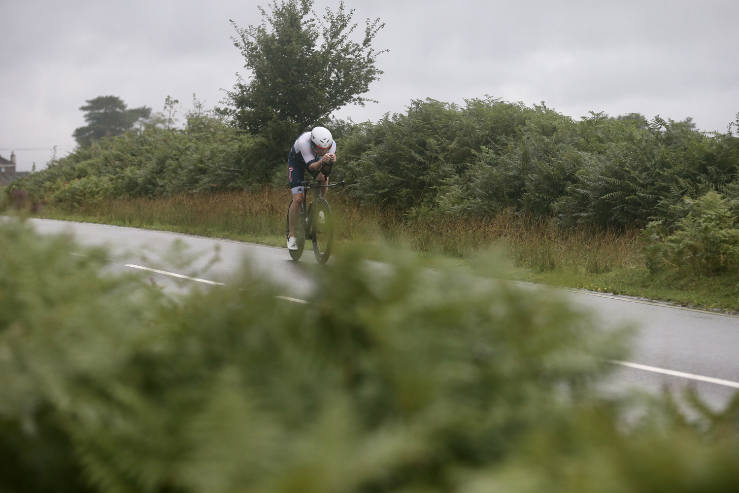 A cyclist on the IRONMAN bike stage through Gower