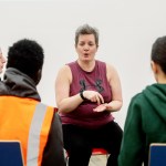 Amazon associate Morag Kitson teaches sign language to her colleagues