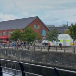Emergency services at Swansea Marina after a car crashed through railings and entered the water