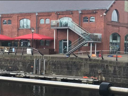 Broken barriers at Swansea Marina after a car entered the water