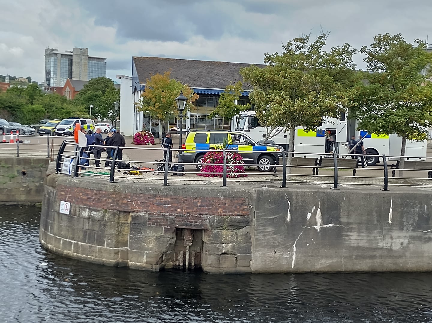 Emergency services at Swansea Marina after a car crashed through railings and entered the water (Image: Gregor Kreithaner)