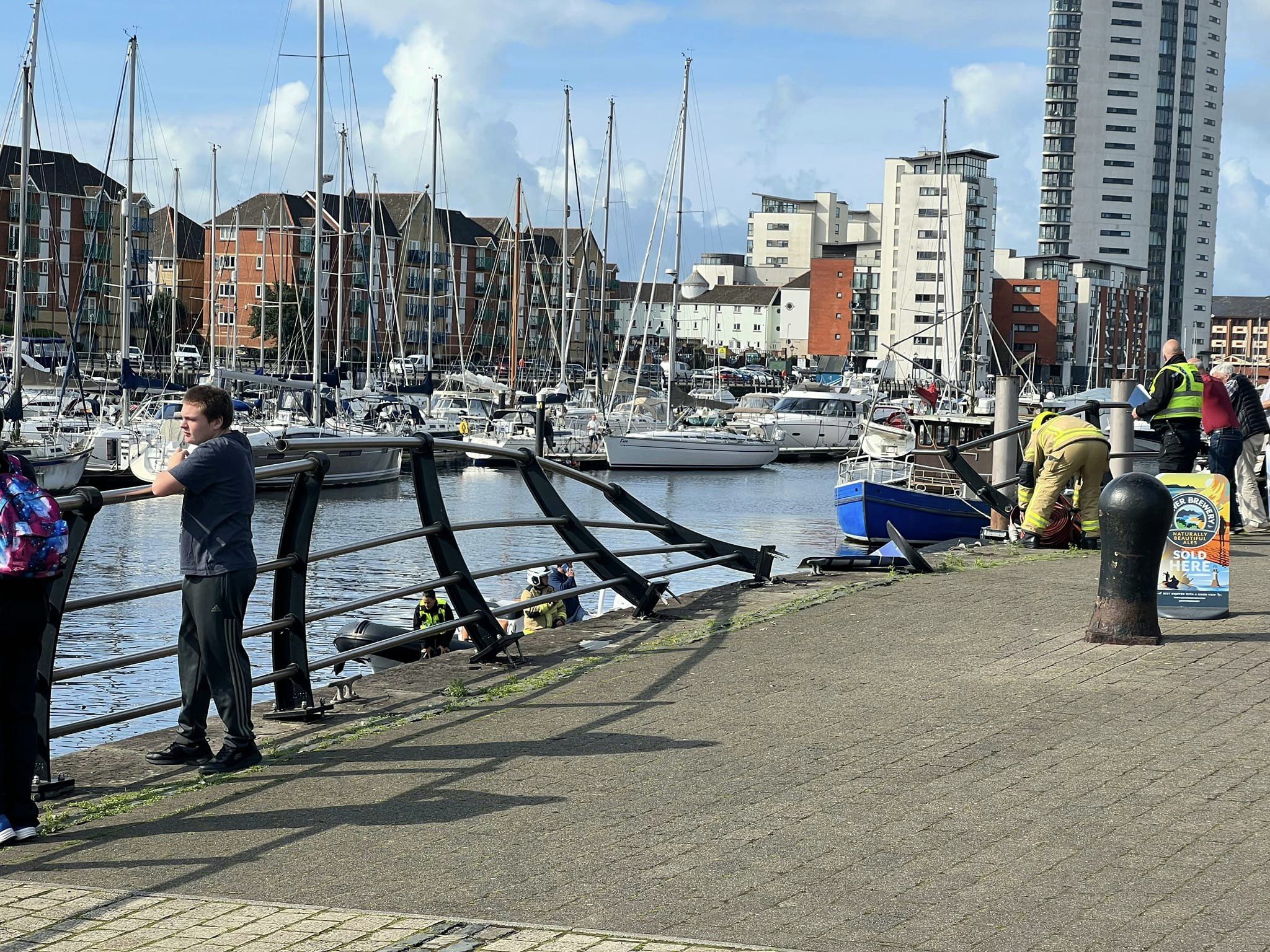 Emergency services at Swansea Marina after a car crashed through railings and entered the water (Image: Swansea Maritime Quarter Residents Association)