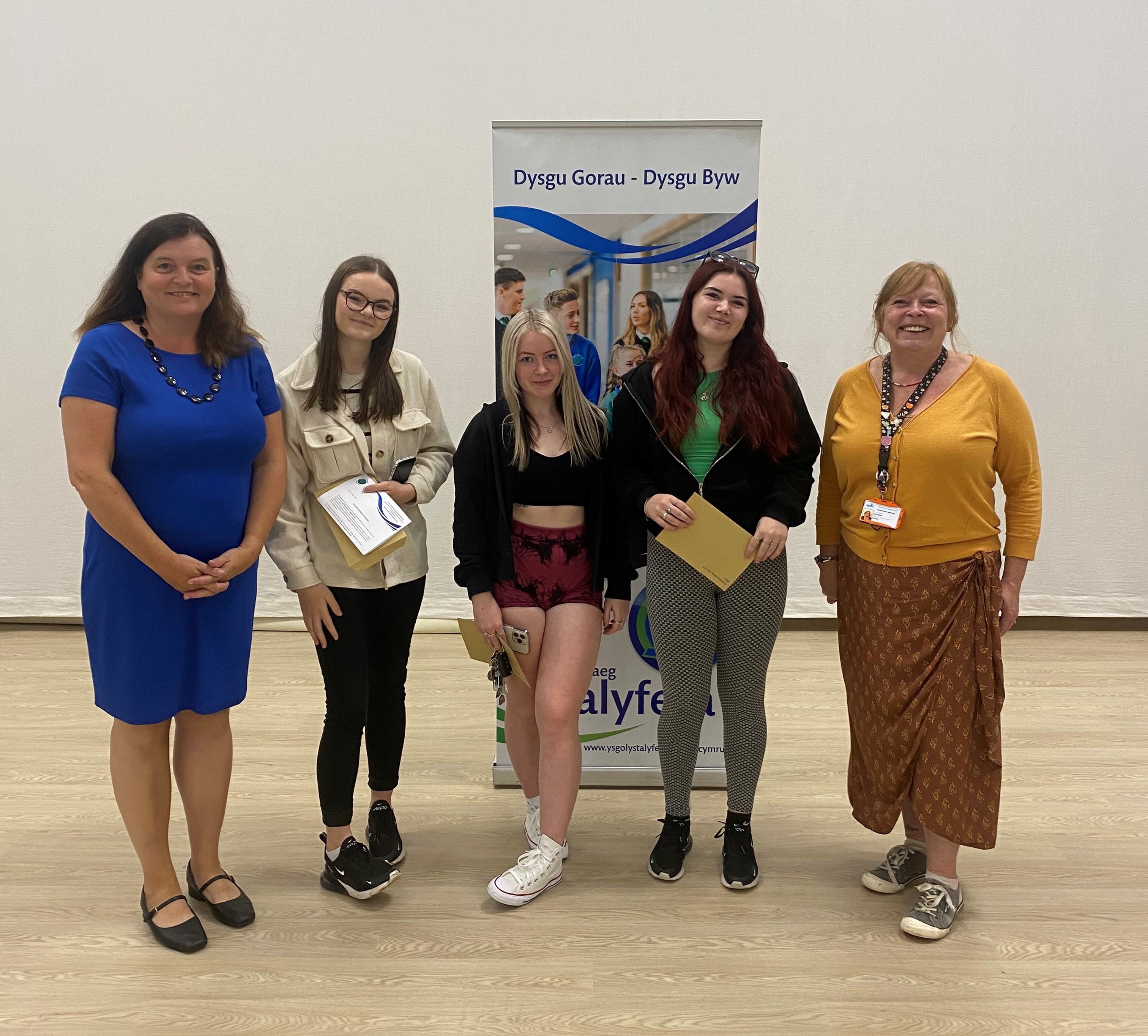 Students at Ysgol Gymraeg Ystalyfera–Bro Dur receiving their A-Level results