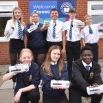 Pupils at Dylan Thomas School with the donated water bottles.