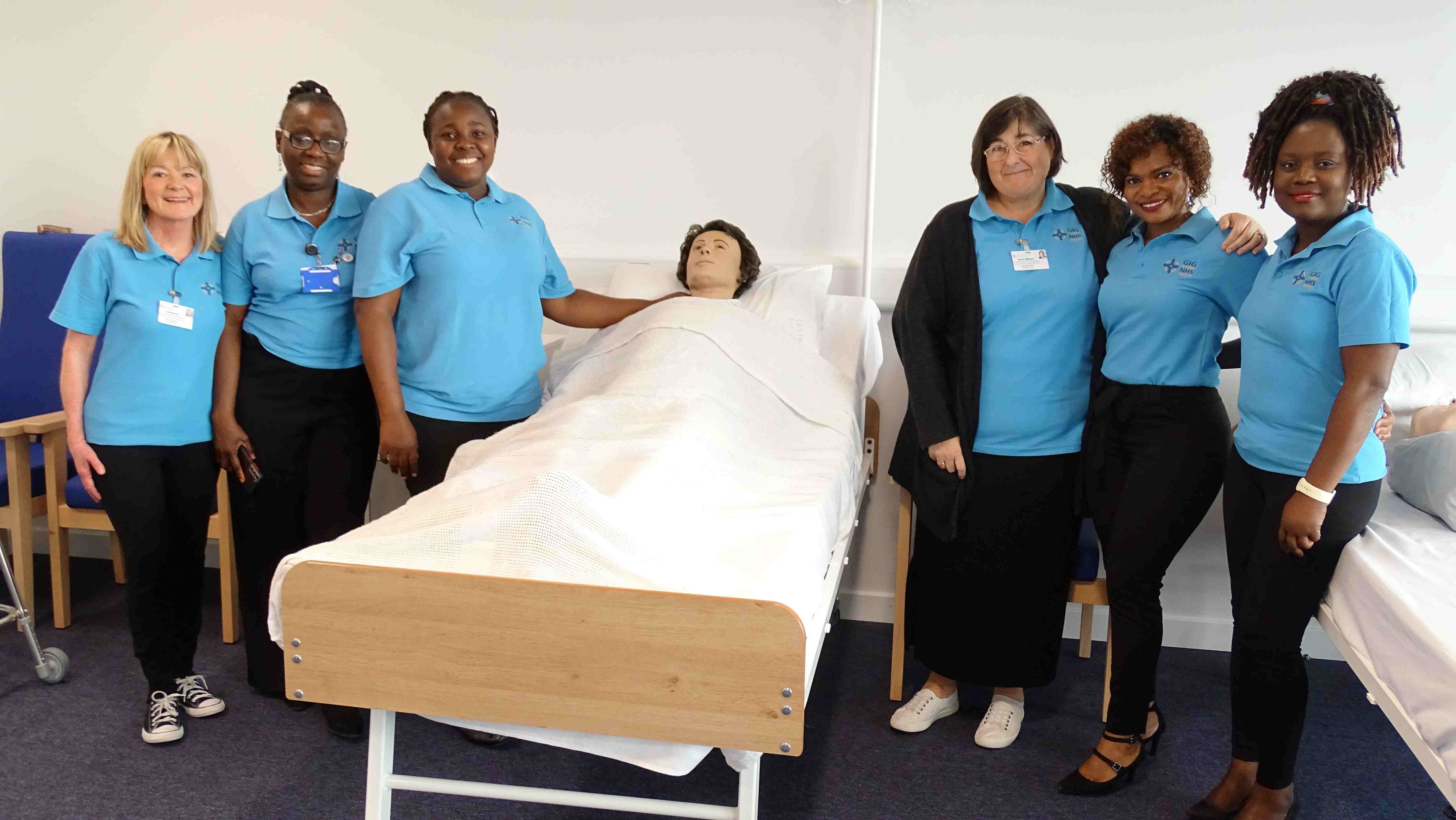 Omobola and her practice development nurse colleagues pictured in the nurse education centre in Baglan, where they prepare overseas nurses before they go onto work within the health board's hospitals.