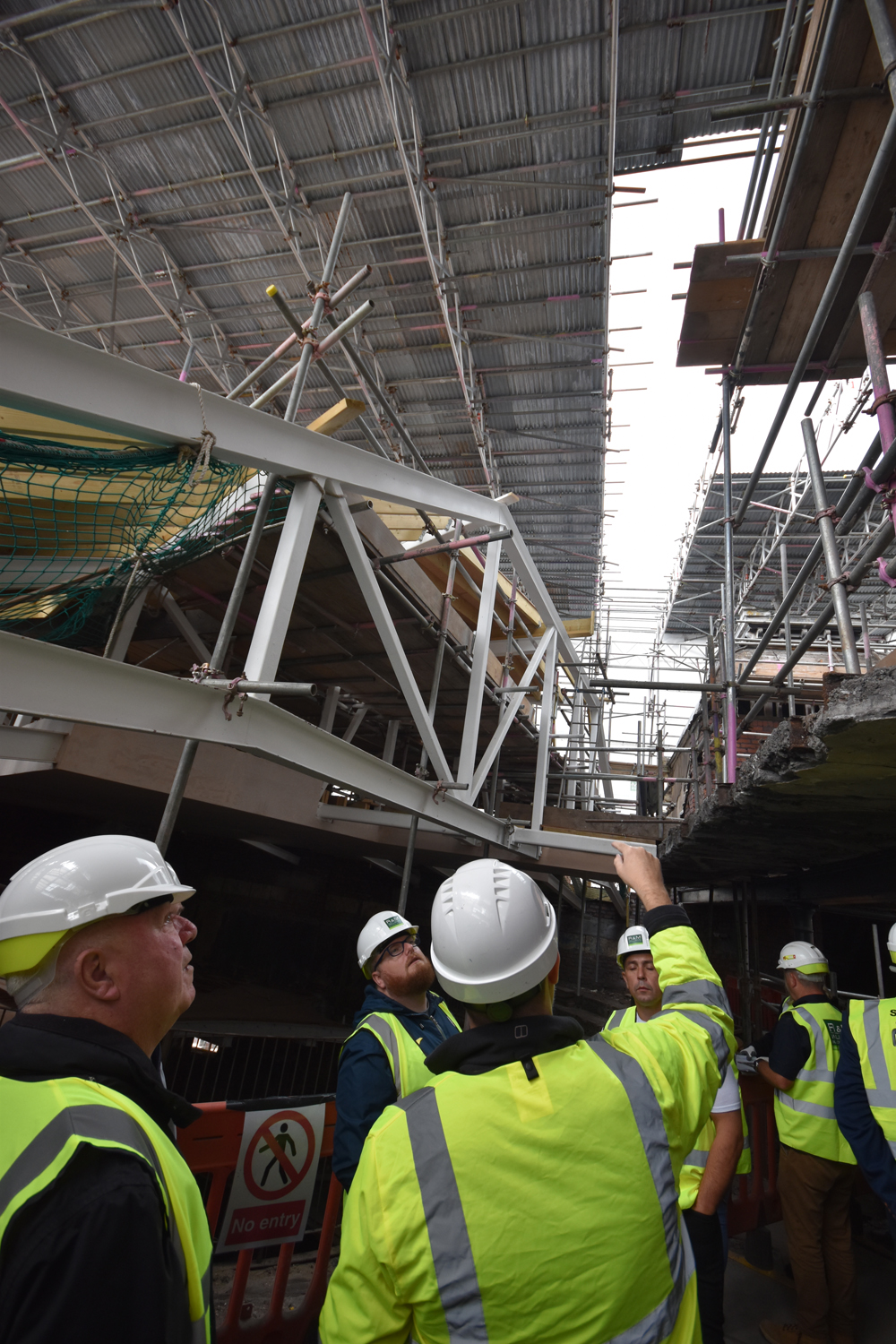 Powerful straight lines being draw in future ceiling spaces at Swansea’s Palace Theatre building.