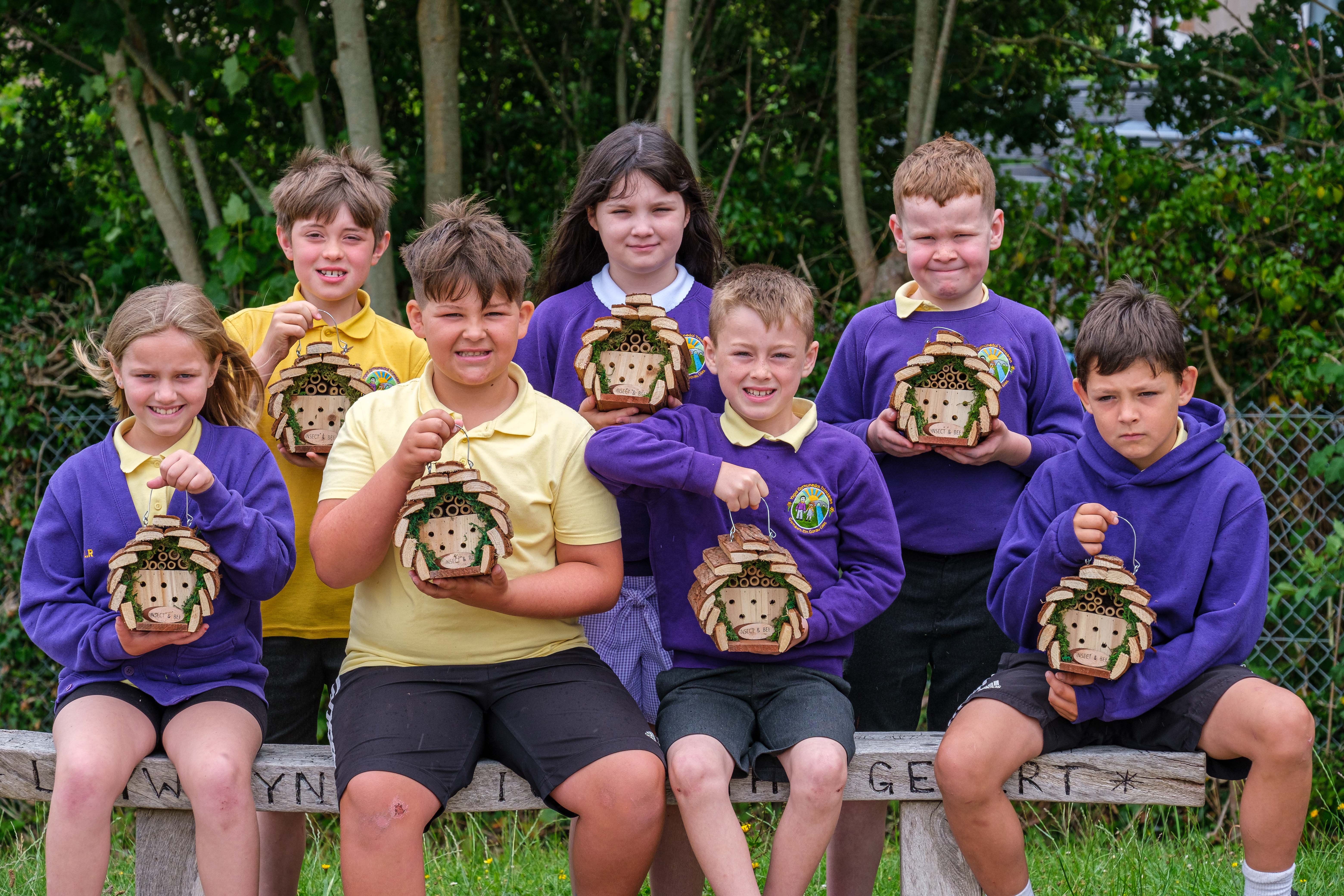 Trimsaran Primary pupils with their 'Bee Hotels'