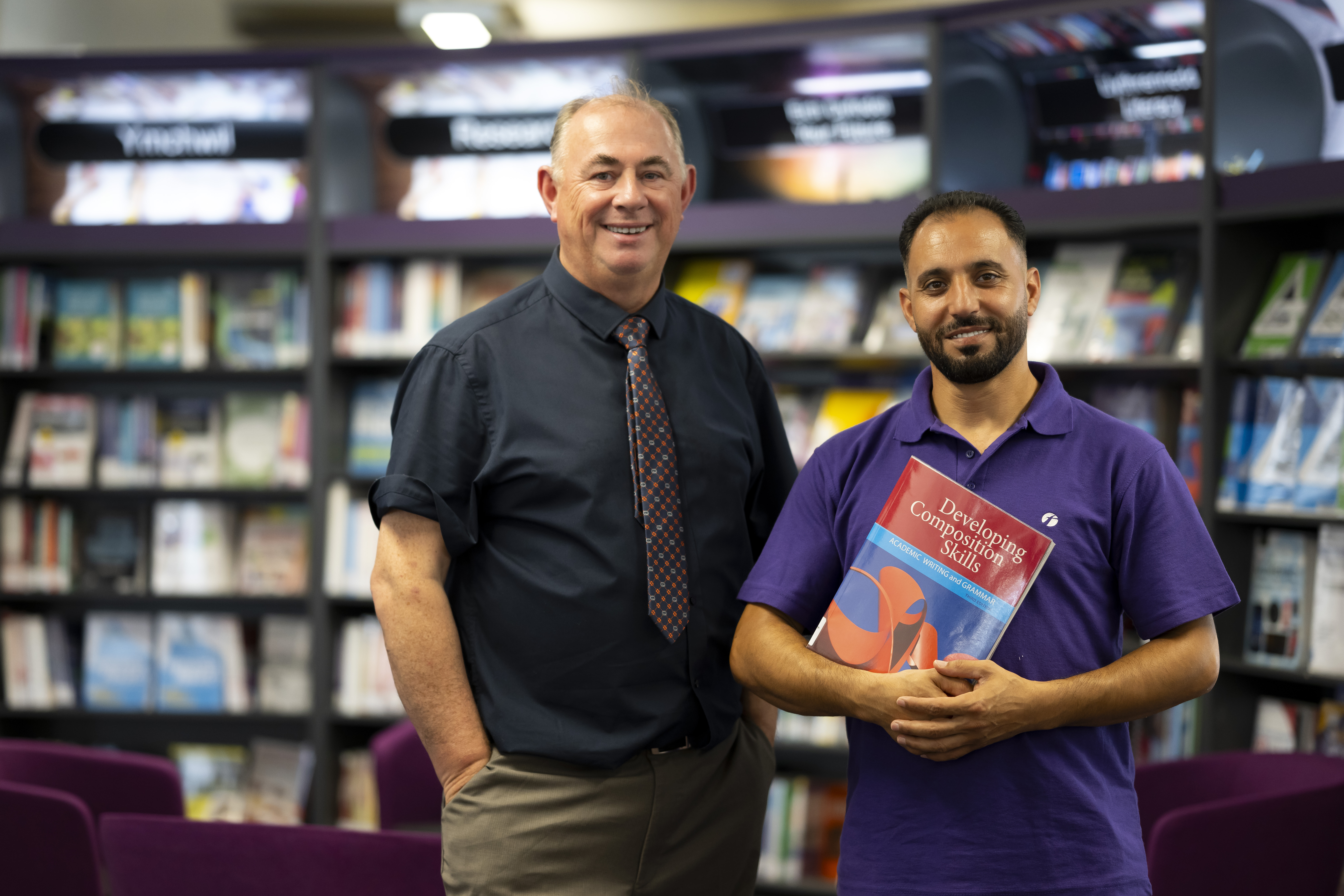 Stephen Oliver, an ESOL lecturer at Gower College Swansea with Walid Musa Albuqai