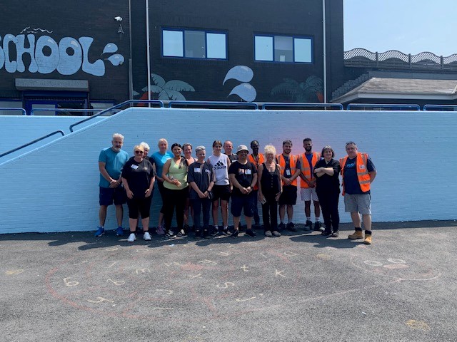 Amazon workers have helped spruce up Hafod Primary School's outdoor space