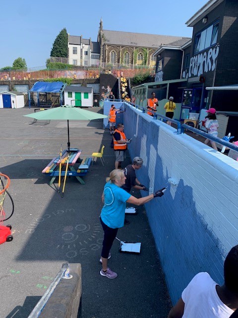 Amazon workers have helped spruce up Hafod Primary School's outdoor space