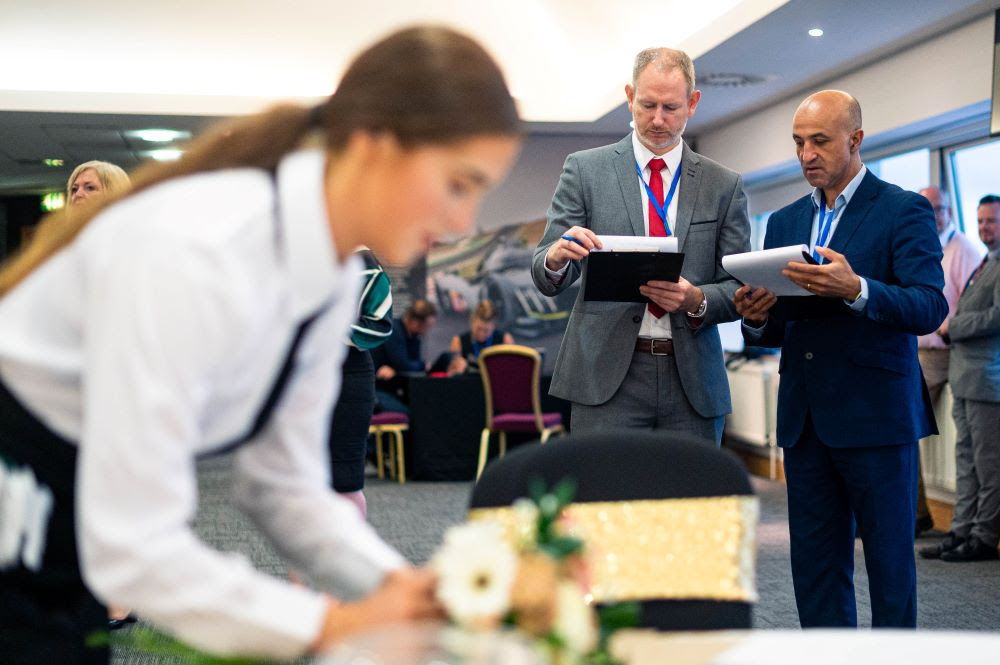 Judges mark wait staff as part of the Wales regional round of World Young Chef Young Waiter (YCYW) competition