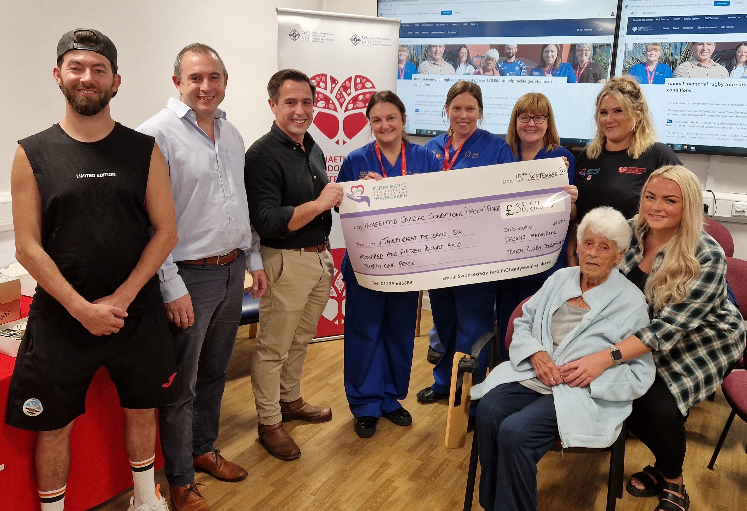 Jason Thomas, Dr Carey Edwards, Councillor Andrew Stevens, Inherited Cardiac Conditions (ICC) nurse Hayley Brown, ICC nurse Louise Norgrove, ICC nurse Suzanne Richards, and Katy Phillips, (seated) grandmother Rosamond Thomas and sister Tiffany Thomas.