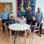 PICTURED: (Front row, from left) Tracey Rowe; Tŷ Olwen Trust chair Helen Murray MBE and Dr Gwenllian Davies. (Back row, from left) Tŷ Olwen Trust's Stuart Roberts, Tracy Hancock, Gareth Lewis and Paul Murray.