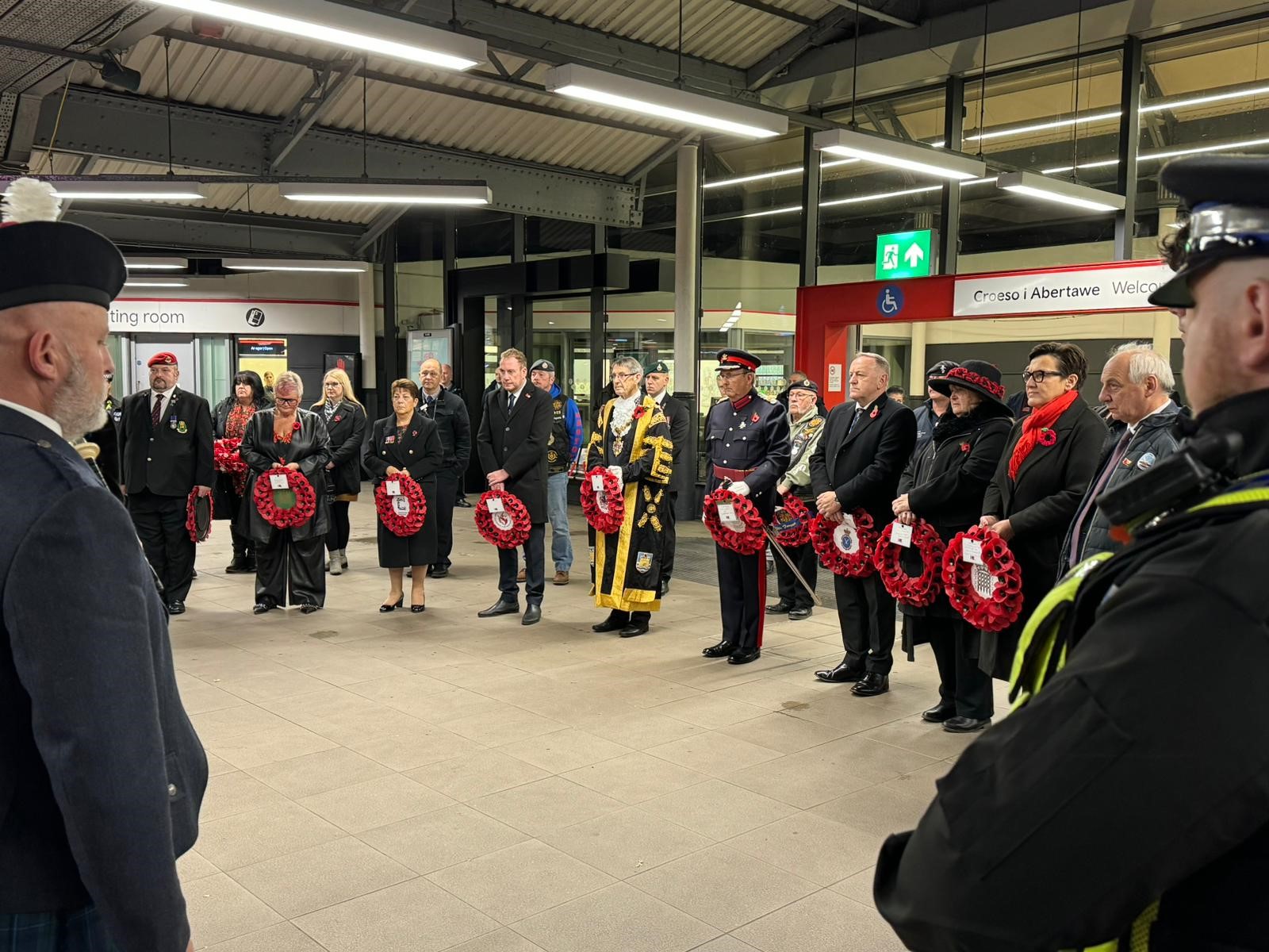 The Lord Mayor of Swansea along with other dignitaries at Swansea Train Station take part in a special remembrance service on the platform.