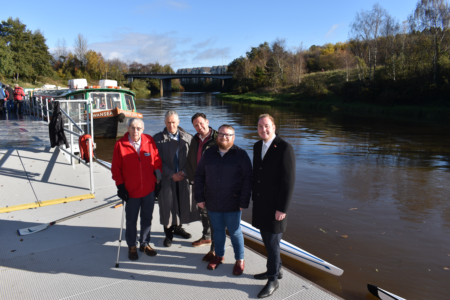 Pictured at the new River Tawe pontoon with Swansea Council leader Rob Stewart, far right, are, from left, Swansea Community Boat Trust president Charles White, Swansea Rowing Club chairman Jonathan Rance, Swansea University associate director of commercial services Ben Lucas and council cabinet member Elliott King. Pic: Swansea Council